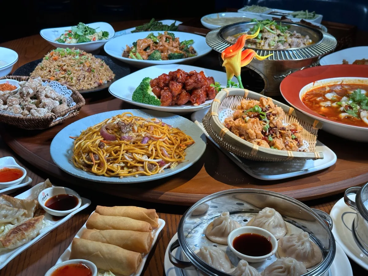 Family-style table spread of Chef Jiang dishes